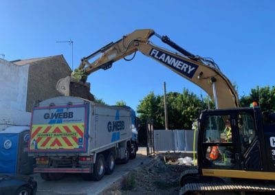 photo of JCB digger loading lorry with asbestos contaminated soil