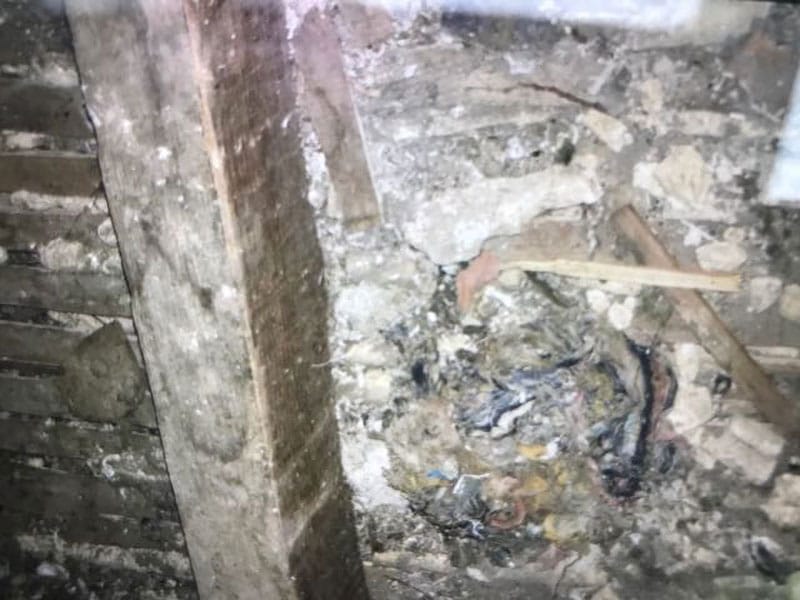 Asbestos products, debris and other within any void in the construction. This includes wall, ceilings, boxings and beneath built constructed items such as cupboard etc. Usually built over or covered historically during refurbishment works.