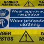 When was asbestos banned in the UK?