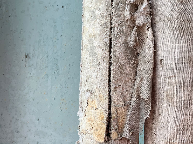 Asbestos insulation appearance – fluffy loose fill, grey pipe lagging, and white insulation board