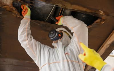 How do UK regulations define proper asbestos management?
