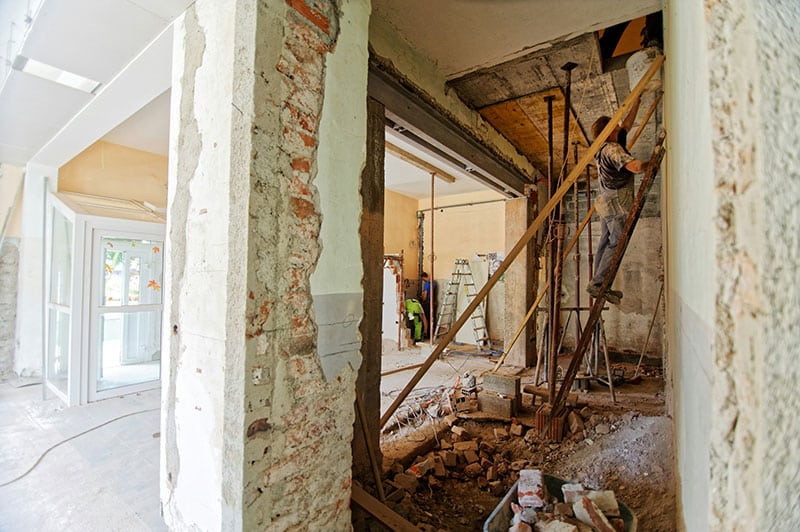 What UK Government regulations on asbestos and home retrofits should I be aware of?